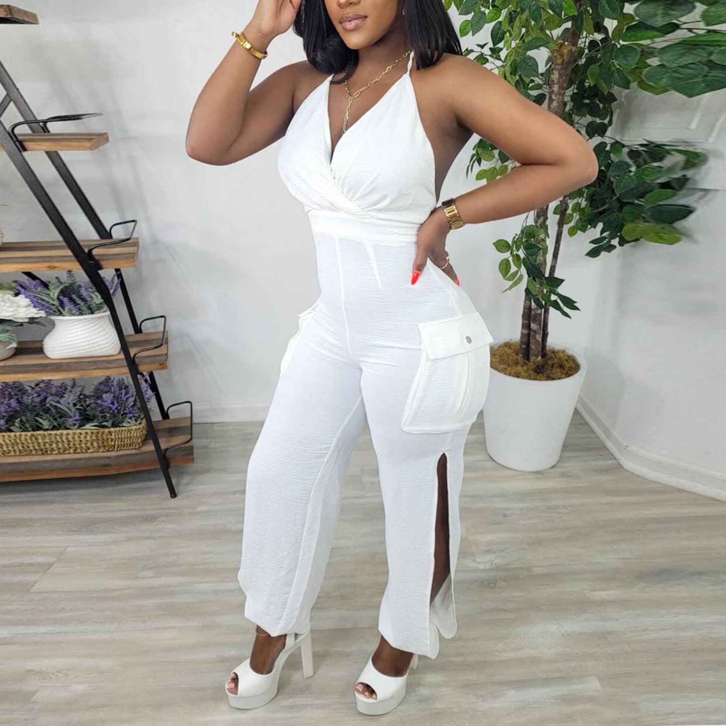 Solid color sling halter neck hollow hip-wrapped jumpsuit