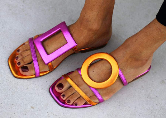 Asymmetric metallic sandals